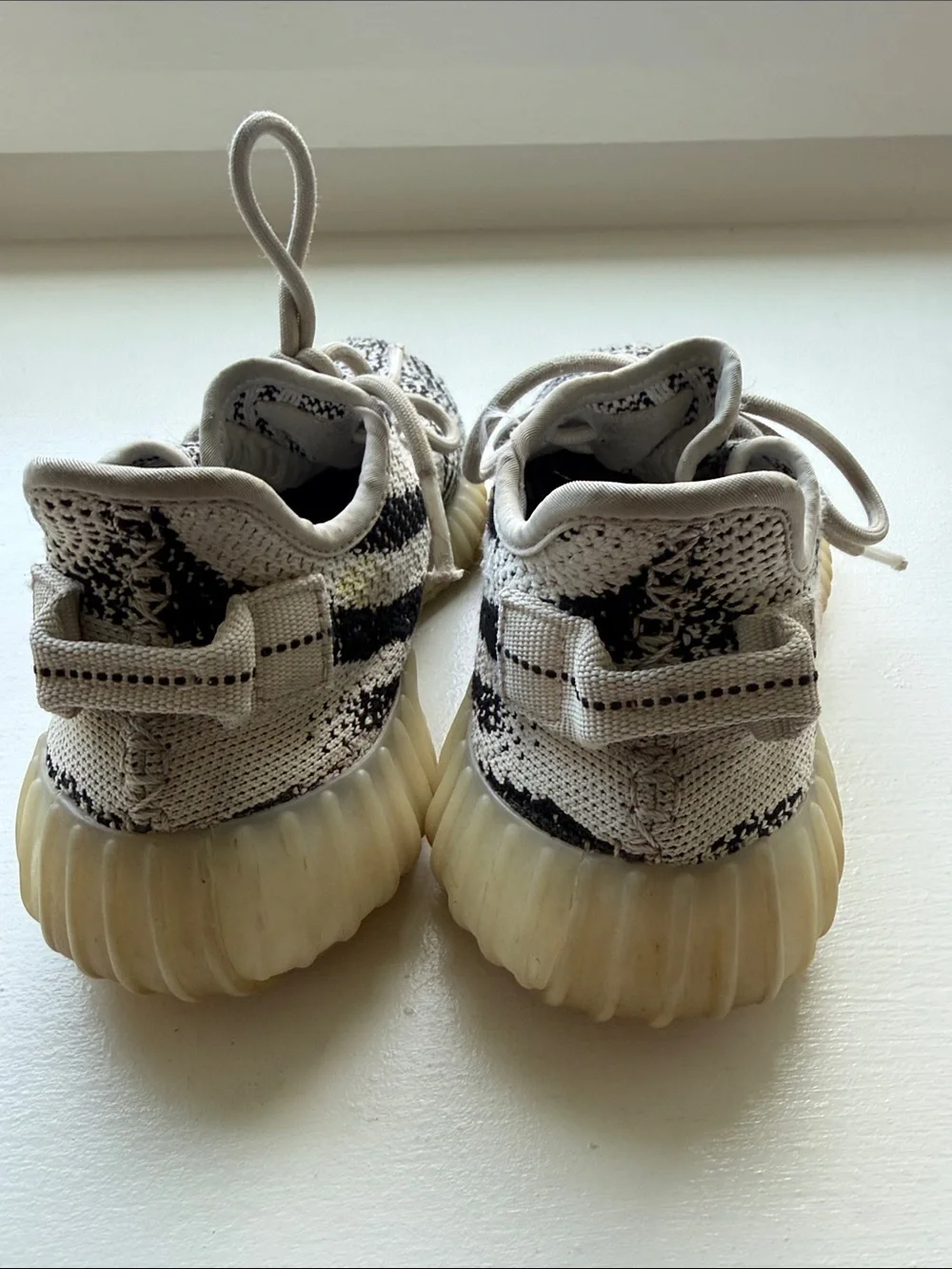 Yeezy Kids Zebra Knit Sneakers in Cream, Black with Red Accent
